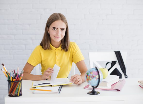 young-girl-studying-desk